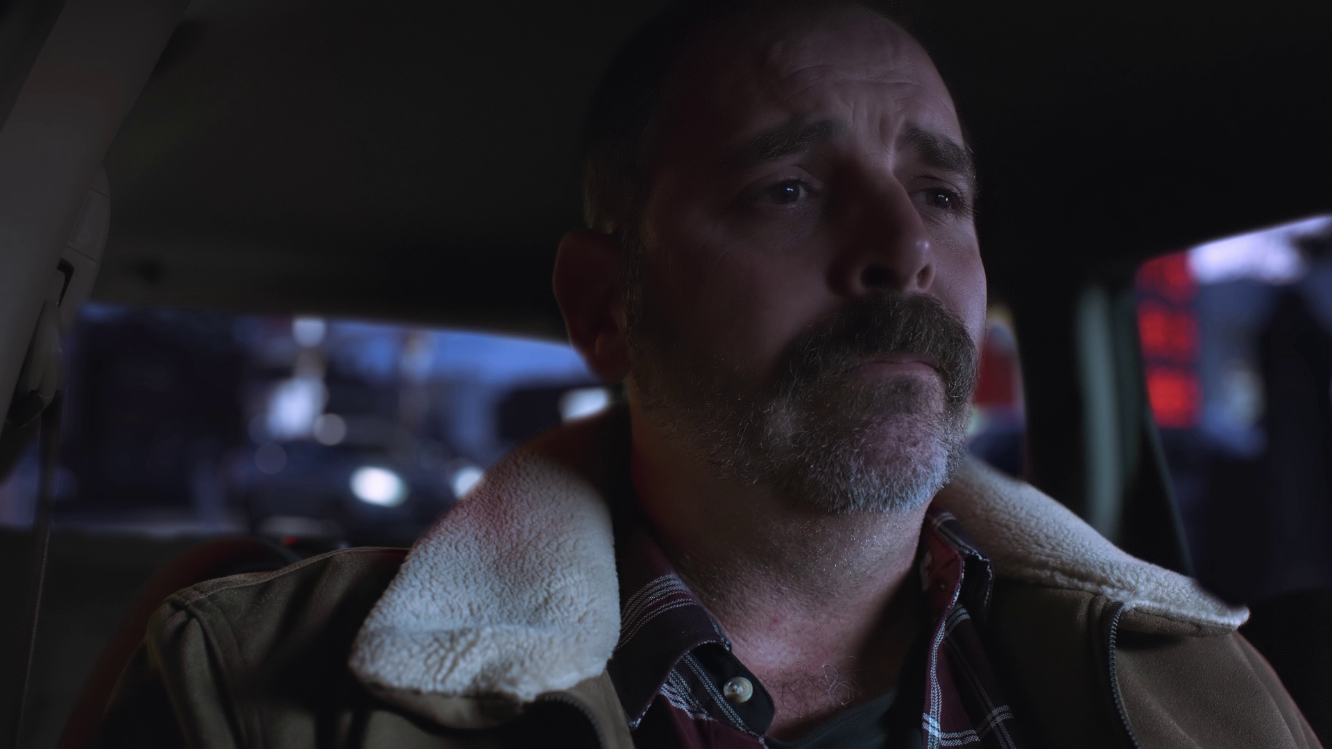 Cinematic still of father looking up with hopeful expression, warm lighting