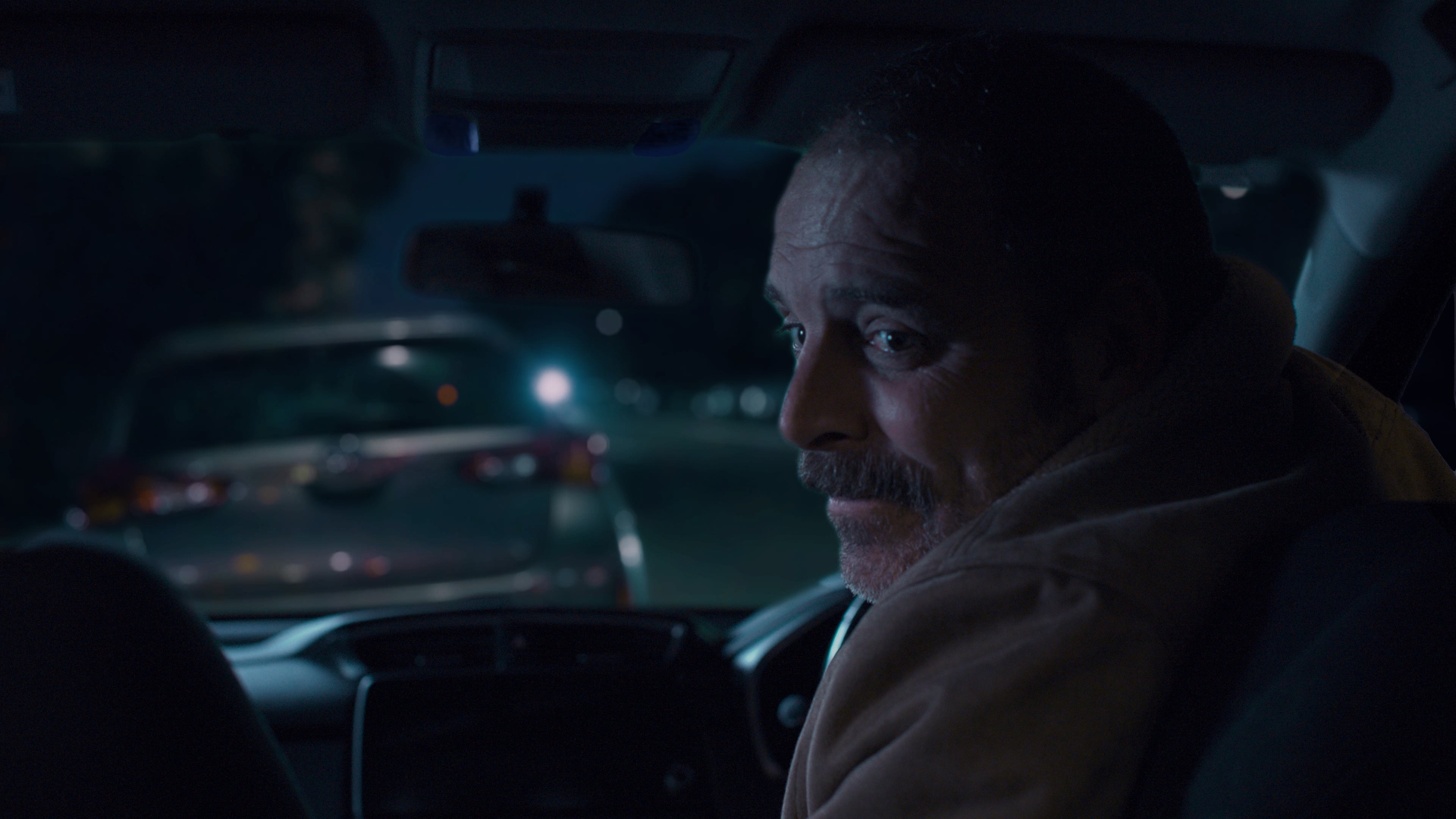 Father and child from backseat angle